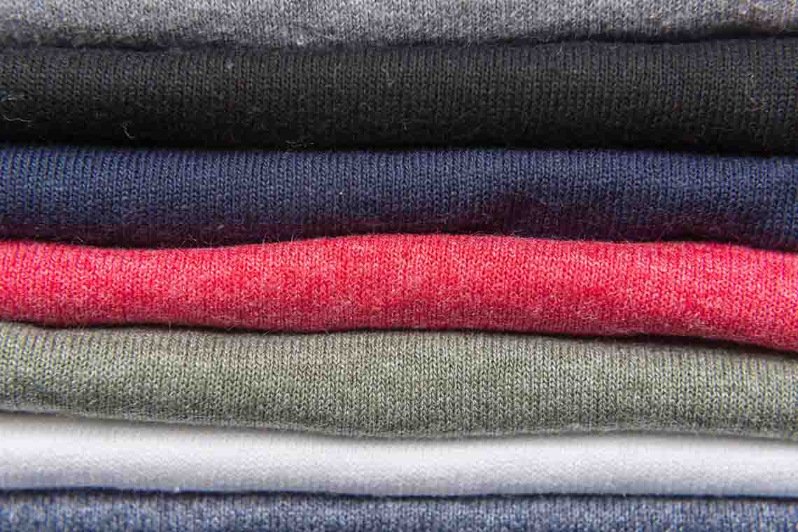 Stack of quality t-shirt materials in various colors